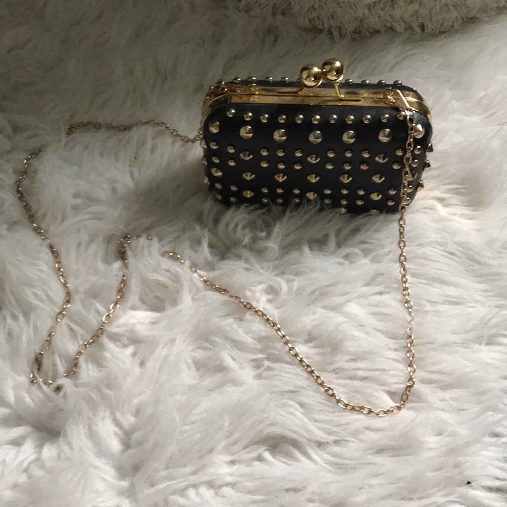 Black and gold studded clutch